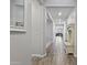 Bright hallway featuring hardwood floors and neutral colored walls for a modern aesthetic at 10165 E Gamma Ave, Mesa, AZ 85212