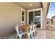 Outdoor dining area showcasing a wooden table and seating for six on a covered patio at 10165 E Gamma Ave, Mesa, AZ 85212