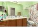 Well-lit bathroom boasts a double sink vanity, mirror, and fresh design for a refreshing experience at 1028 S Valle Verde --, Mesa, AZ 85208