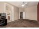 This bedroom features neutral walls, carpeted floors, and a ceiling fan for ultimate comfort at 1028 S Valle Verde --, Mesa, AZ 85208