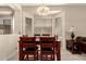 Dining room with wood table and chairs, large window letting in natural light at 1028 S Valle Verde --, Mesa, AZ 85208