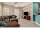 View of the Living Room showing modern grey laminate flooring and a flatscreen TV at 1028 S Valle Verde --, Mesa, AZ 85208