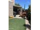 A well-maintained lawn and patio includes outdoor seating, perfect for outdoor gatherings and relaxation at 12421 N 41St Pl, Phoenix, AZ 85032