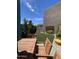 Outdoor patio with a table, lawn, and an umbrella, providing an ideal place for outdoor enjoyment at 12421 N 41St Pl, Phoenix, AZ 85032