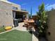 Patio and lawn are framed by lush trees, providing ample privacy and serenity for outdoor enjoyment at 12421 N 41St Pl, Phoenix, AZ 85032