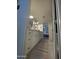 Bright bathroom featuring double vanity with round mirrors, neutral tile floor, and bedroom doorway at 12421 N 41St Pl, Phoenix, AZ 85032