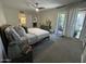 Spacious bedroom with an open layout, mirrored closets, and a sliding glass door to the outside at 12421 N 41St Pl, Phoenix, AZ 85032