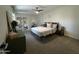 Comfortable bedroom with a ceiling fan and mirrored closet doors for extra space at 12421 N 41St Pl, Phoenix, AZ 85032
