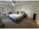 Well-lit bedroom featuring a ceiling fan and mirrored closets for a bright, airy feel at 12421 N 41St Pl, Phoenix, AZ 85032