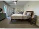 Bright bedroom with ample natural light, mirrored closets, and a ceiling fan at 12421 N 41St Pl, Phoenix, AZ 85032