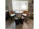 Bright breakfast nook featuring a table and chairs with a view from the window at 12421 N 41St Pl, Phoenix, AZ 85032
