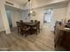 Bright dining room with a rustic wood table and easy access to other rooms at 12421 N 41St Pl, Phoenix, AZ 85032