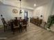 Well-lit dining room with a unique hanging light and vintage sideboard at 12421 N 41St Pl, Phoenix, AZ 85032