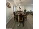 Inviting dining room featuring a unique light fixture and a sombrero on the wall at 12421 N 41St Pl, Phoenix, AZ 85032