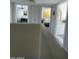 Bright hallway offers views of a bedroom, office, and bathroom, showcasing the home's layout and design at 12421 N 41St Pl, Phoenix, AZ 85032