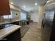 Bright kitchen with stainless steel appliances and tile flooring at 12421 N 41St Pl, Phoenix, AZ 85032