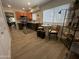 Bright kitchen with stainless steel appliances, wooden flooring, and a cozy breakfast nook at 12421 N 41St Pl, Phoenix, AZ 85032