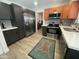 Modern kitchen featuring stainless steel appliances and stylish cabinets at 12421 N 41St Pl, Phoenix, AZ 85032