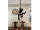 Close-up of a whimsical monkey light fixture above the dining table at 12421 N 41St Pl, Phoenix, AZ 85032