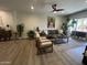 Bright living room featuring a ceiling fan, comfortable seating, and stylish accents at 12421 N 41St Pl, Phoenix, AZ 85032