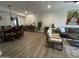 Open concept living room with modern decor, ceiling fan, and dining area at 12421 N 41St Pl, Phoenix, AZ 85032