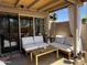 Outdoor patio featuring comfortable lounge seating adjacent to a large sliding glass door at 12421 N 41St Pl, Phoenix, AZ 85032