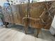 Detail of a wooden sideboard with a deer carving and decorative accents at 12421 N 41St Pl, Phoenix, AZ 85032