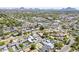 Wide aerial view of a residential area highlighting a mix of homes, mature trees, and neighborhood streets at 1274 E Edgemont Ave, Phoenix, AZ 85006