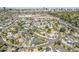 Scenic aerial view of a neighborhood featuring winding roads, mature trees, and a school in the distance at 1274 E Edgemont Ave, Phoenix, AZ 85006