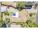 Aerial view of home showcasing the backyard, pool, mature trees, and surrounding neighborhood at 1274 E Edgemont Ave, Phoenix, AZ 85006