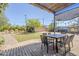 Backyard features an outdoor dining area with mature landscaping, a mural and plenty of space at 1274 E Edgemont Ave, Phoenix, AZ 85006