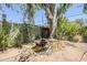 Backyard features a small pond with mature landscaping and rock border at 1274 E Edgemont Ave, Phoenix, AZ 85006