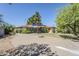Large backyard featuring a covered patio and a spacious driveway, perfect for outdoor living and entertaining at 1274 E Edgemont Ave, Phoenix, AZ 85006