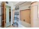 This bathroom features a shower with pink tile and a decorative shower curtain at 1274 E Edgemont Ave, Phoenix, AZ 85006