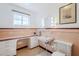 Vintage bathroom featuring vanity, sink, and toilet, with tiled accents and natural light at 1274 E Edgemont Ave, Phoenix, AZ 85006