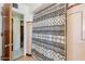 This bathroom features a shower with pink tile and a decorative shower curtain at 1274 E Edgemont Ave, Phoenix, AZ 85006
