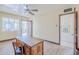 Spacious bedroom with a desk, closet, and wood-look flooring at 1274 E Edgemont Ave, Phoenix, AZ 85006