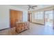 Bright bedroom with desk and closet, complemented by wood-look flooring and a fan at 1274 E Edgemont Ave, Phoenix, AZ 85006