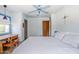 Bright bedroom features a blue ceiling fan, hardwood floors, and plenty of natural light at 1274 E Edgemont Ave, Phoenix, AZ 85006