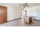 Well-lit bedroom with warm-toned walls, wood-look floors, and ceiling fan at 1274 E Edgemont Ave, Phoenix, AZ 85006