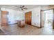 Expansive bedroom featuring wood-look floors, fan, and ample closet space at 1274 E Edgemont Ave, Phoenix, AZ 85006