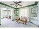 Bright dining room with tile floors and an archway to living room, plus vintage style cabinetry at 1274 E Edgemont Ave, Phoenix, AZ 85006