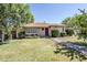 Charming single-story home with well-maintained lawn, mature trees, and a brick walkway at 1274 E Edgemont Ave, Phoenix, AZ 85006