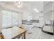 The bright kitchen features white cabinetry, tile countertops and a cozy breakfast nook at 1274 E Edgemont Ave, Phoenix, AZ 85006