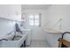 A simple laundry room with white appliances and a utility sink at 1274 E Edgemont Ave, Phoenix, AZ 85006