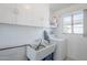 A simple laundry room with white appliances and a utility sink at 1274 E Edgemont Ave, Phoenix, AZ 85006