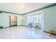 Inviting living room with bright windows, white tile floors, and decorative trim at 1274 E Edgemont Ave, Phoenix, AZ 85006