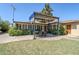 Outdoor patio with a dining set, perfect for enjoying meals in the landscaped backyard at 1274 E Edgemont Ave, Phoenix, AZ 85006