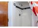 A shower stall with white tiles and a retro shower head at 1274 E Edgemont Ave, Phoenix, AZ 85006