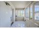 A bright sunroom with white-painted brick walls and multiple windows at 1274 E Edgemont Ave, Phoenix, AZ 85006